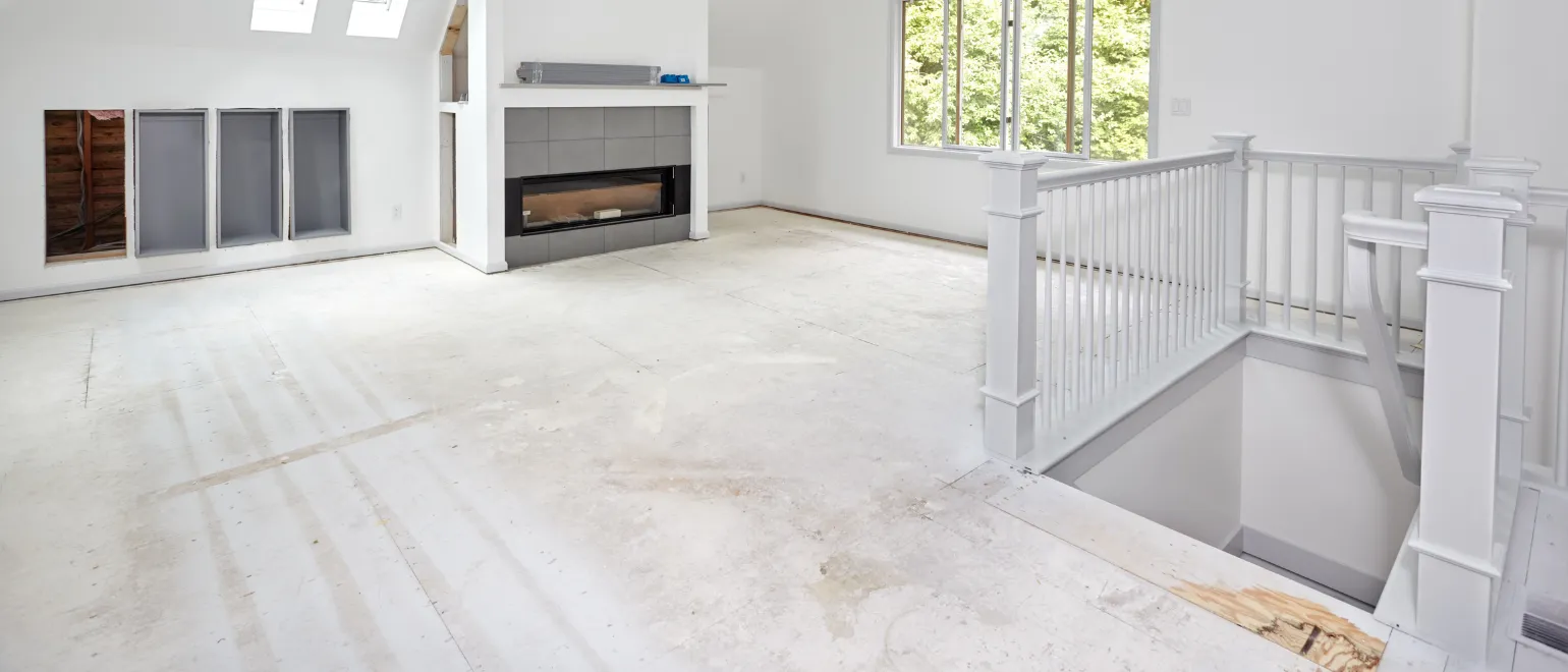 Full home remodeling in Los Angeles with open living room renovation, fireplace upgrade, stair railing detail, skylights, and interior construction progress