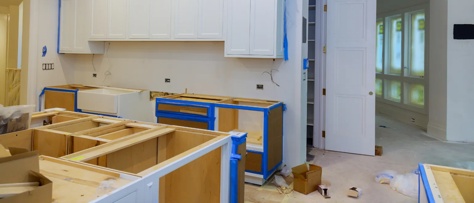 Kitchen remodeling in Los Angeles with custom cabinet layout installation, farmhouse sink preparation, electrical updates, and premium renovation work in progress