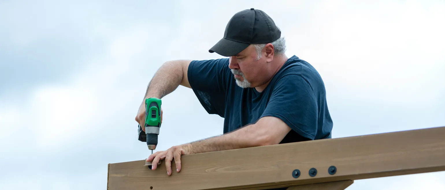 Outdoor living remodeling in Los Angeles with pergola construction, wood deck framing, and backyard entertainment space buildout