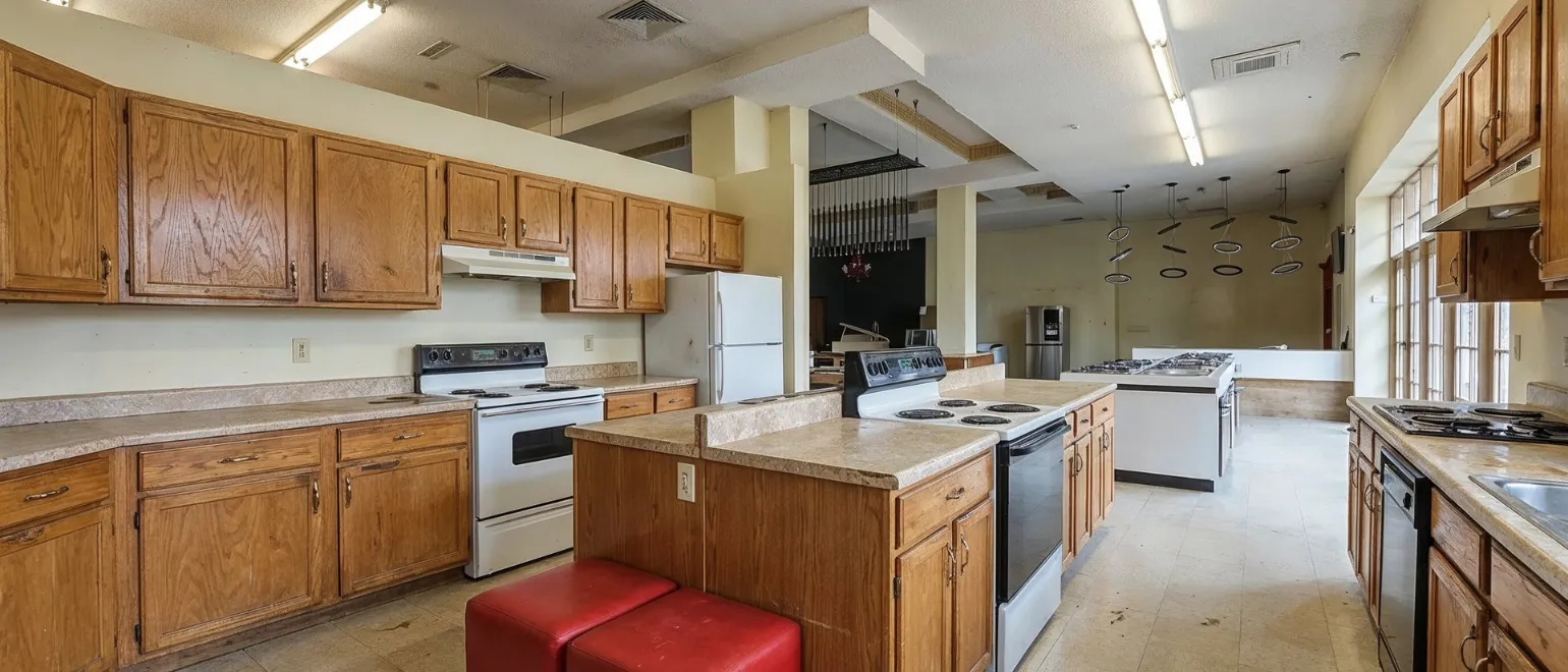 Before commercial remodeling project in Los Angeles showing outdated business interior, old cabinets, worn finishes, poor lighting, and inefficient commercial layout before renovation